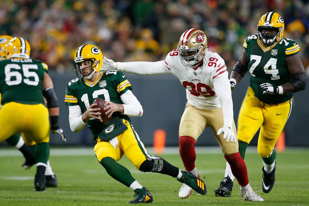 DeForest Buckner of the San Francisco 49ers sacks Aaron Rogers of the Green Bay Packers during the game at Lambeau Field on October 15, 2018 in Green Bay, Wisconsin.