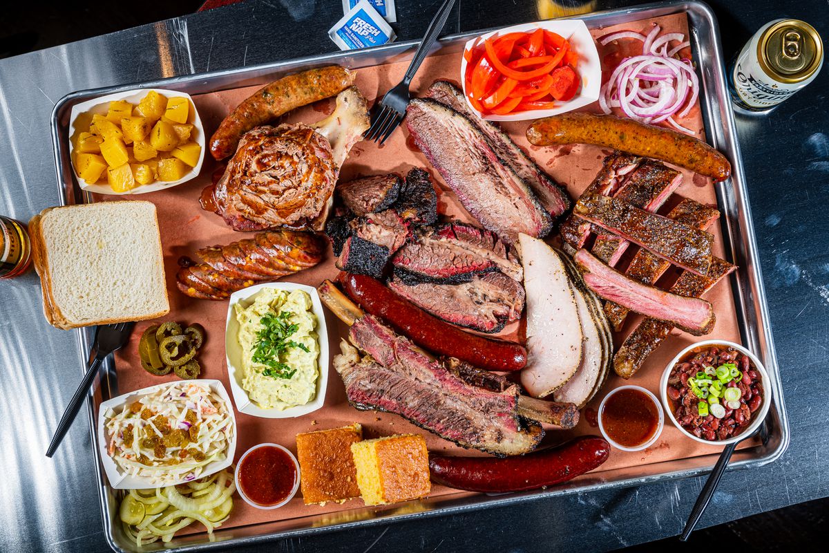 A huge board of smoked meats and sides at 2Fifty.