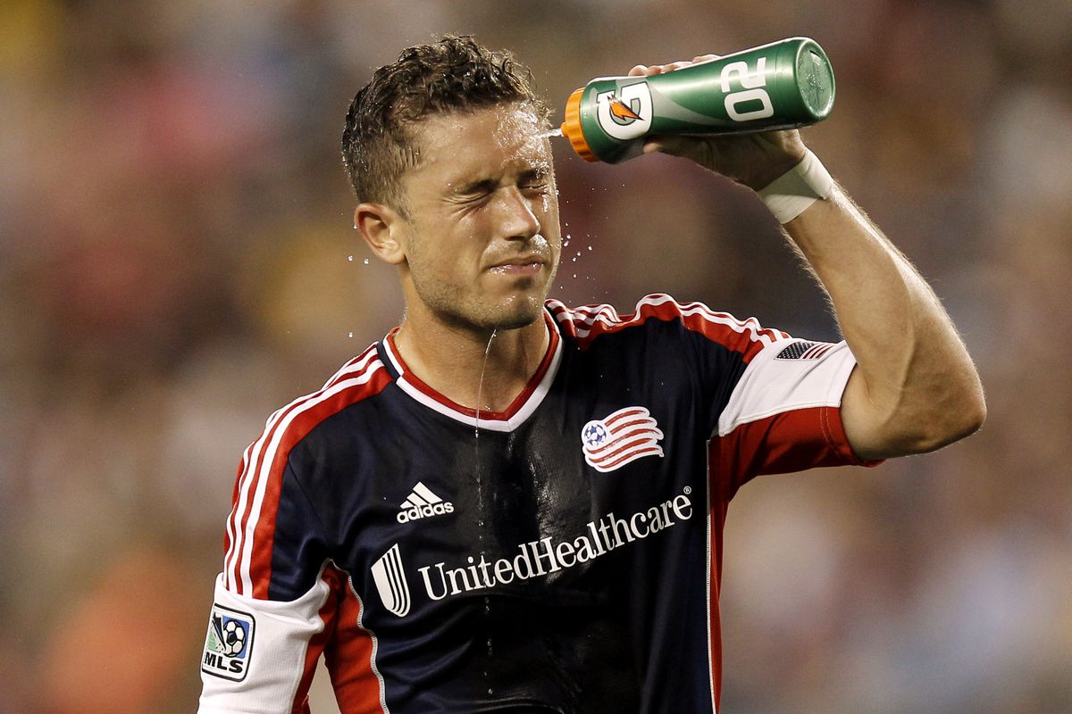 FOXBORO, MA - JULY 14:  Chris Tierney #8 of New England Revolution sprays water on his head during the second half against the Toronto FC at Gillette Stadium on July 14, 2012 in Foxboro, Massachusetts.  (Photo by Winslow Townson/Getty Images)