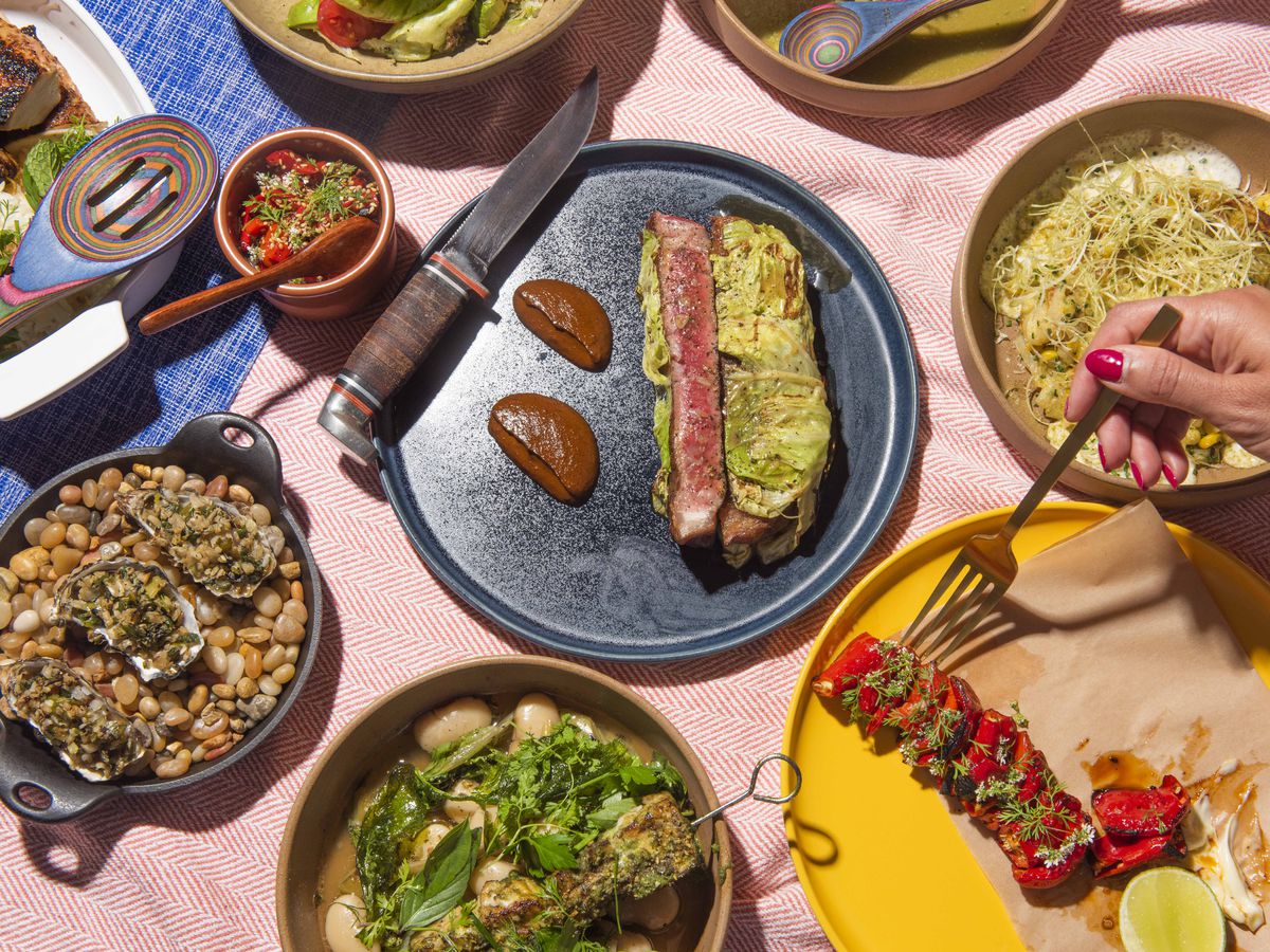 A table of colorful plates of food from Copas on Marker