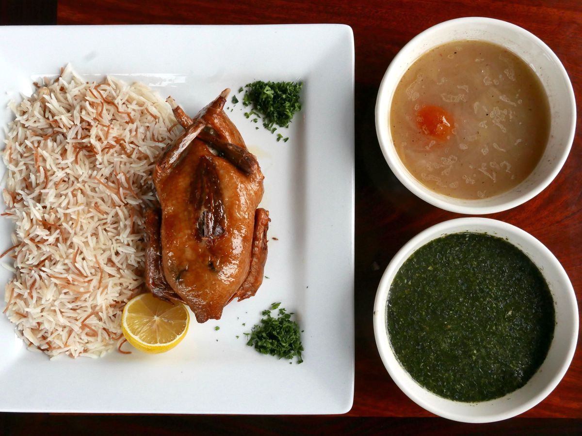 Mahshy, roast quail from El Mahroosa, with a side of rice.