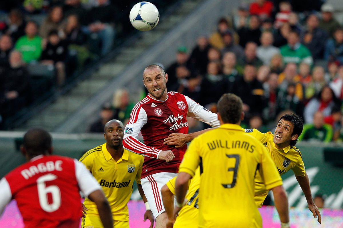 Portland, OR - May 5:  Kris Boyd #9 of the Portland Timbers heads the ball against the Columbus Crew at Jeld-Wen Field. 