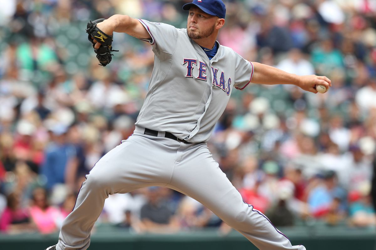 SEATTLE, WA - JULY 15:  Starting pitcher Matt Harrison #54 of the Texas Rangers pitches against the Seattle Mariners at Safeco Field on July 15, 2012 in Seattle, Washington.  (Photo by Otto Greule Jr/Getty Images)