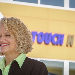 Salt Lake City Mayor Jackie Biskupski smiles while giving an interview outside the Touch 'N Go Convenience Store at the new park and wait lot at the Salt Lake City International Airport in Salt Lake on Tuesday, Dec. 19, 2017.