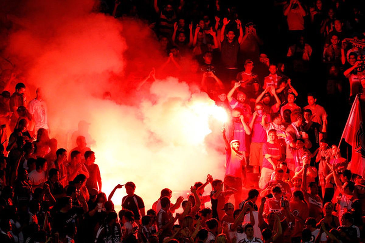 CHICAGO - MAY 30:  A flare is lit in the crowd in the second half during the international friendly between AC Milan and the Chicago Fire at Toyota Park on May 30, 2010 in Chicago, Illinois.  (Photo by Jonathan Daniel/Getty Images)