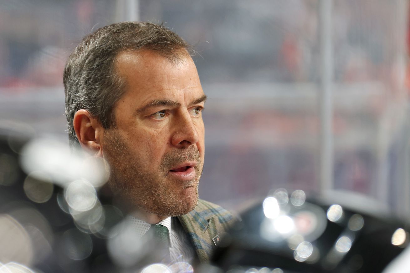 Head Coach Alain Vigneault of the Philadelphia Flyers looks on from the bench during the first period against the Carolina Hurricanes at the Wells Fargo Center on November 26, 2021 in Philadelphia, Pennsylvania.