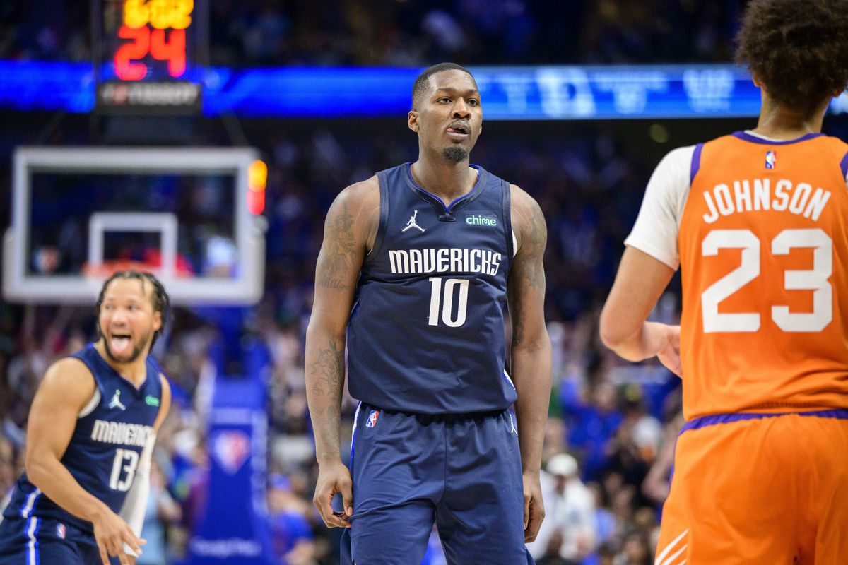 Dallas Mavericks forward Dorian Finney-Smith (10) celebrates making a three point basket over Phoenix Suns forward Cameron Johnson (23) during the fourth quarter during game four of the second round for the 2022 NBA playoffs at American Airlines Center.