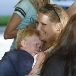 Liz Watson, holds her son, Jericho, who is a bone marrow donor for his brother, Jacob, Monday, June 3, 2013, in Sandy as a group of families whose children have cancer meet to discuss logistics for a Ragnar race in June where their team, "If my kid can fight cancer, I can run Ragnar!" will run in honor of their children.