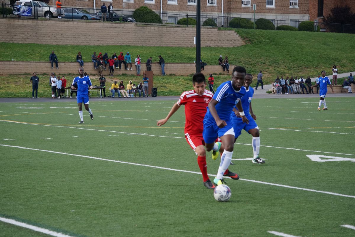Junior Lone Star's midfielder Dodji Freitas (Lome,Togo / Holy Family University) eludes an Eagles medfielder during the game