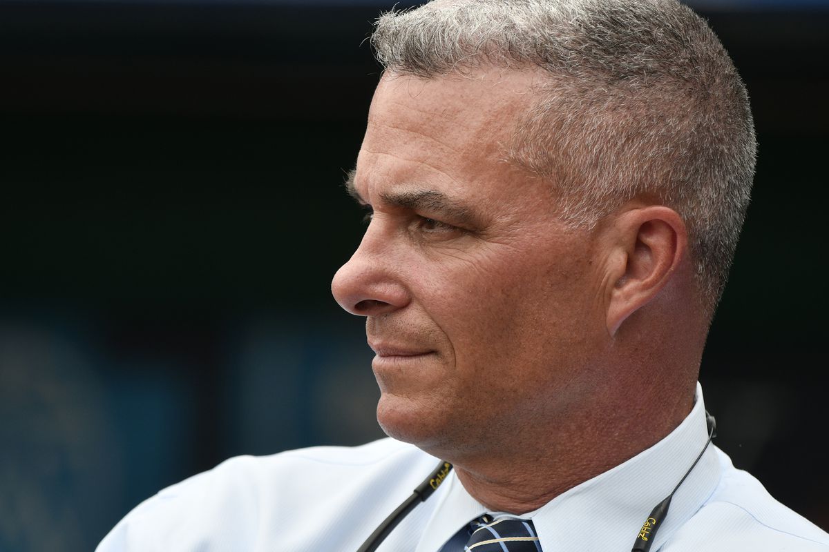 Dayton Moore general manager of the Kansas City Royals watches batting practice prior to a game against the Cincinnati Reds at Kauffman Stadium on June 12, 2018 in Kansas City, Missouri.