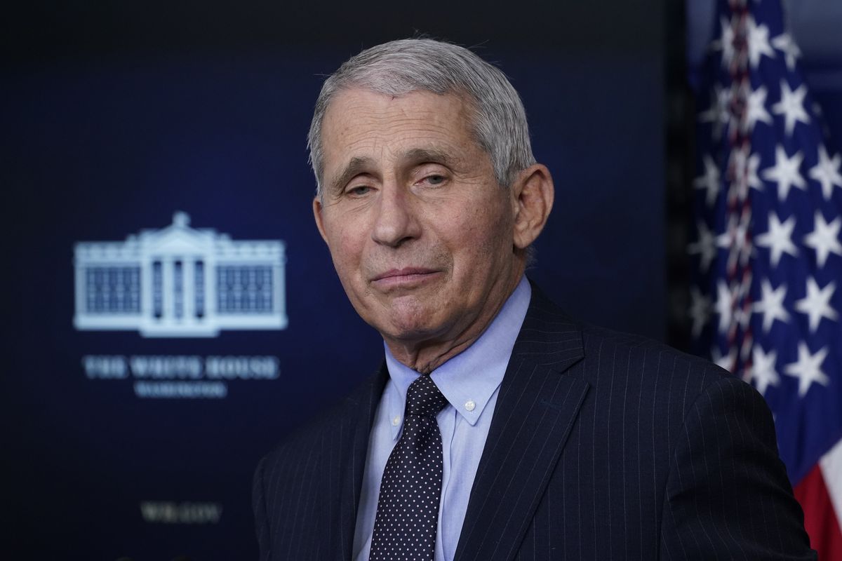Dr. Anthony Fauci, director of the National Institute of Allergy and Infectious Diseases, listens as he speaks with reporters in the James Brady Press Briefing Room at the White House, Thursday, Jan. 21, 2021, in Washington.