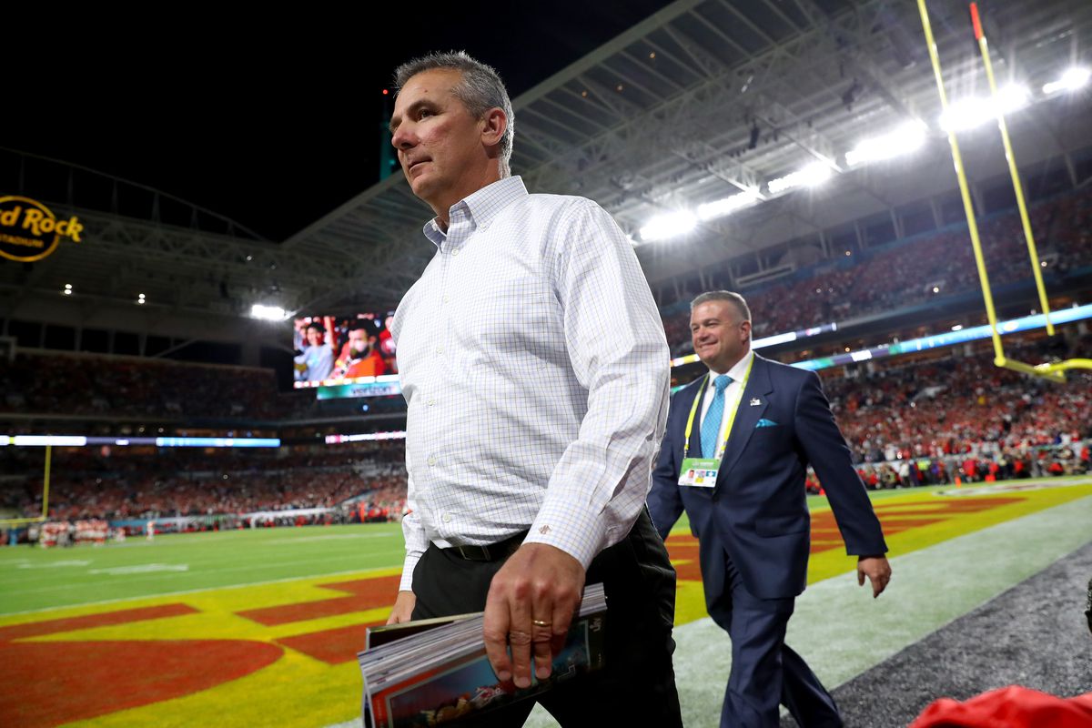Urban Meyer walks on the field in Super Bowl LIV at Hard Rock Stadium on February 02, 2020 in Miami, Florida.