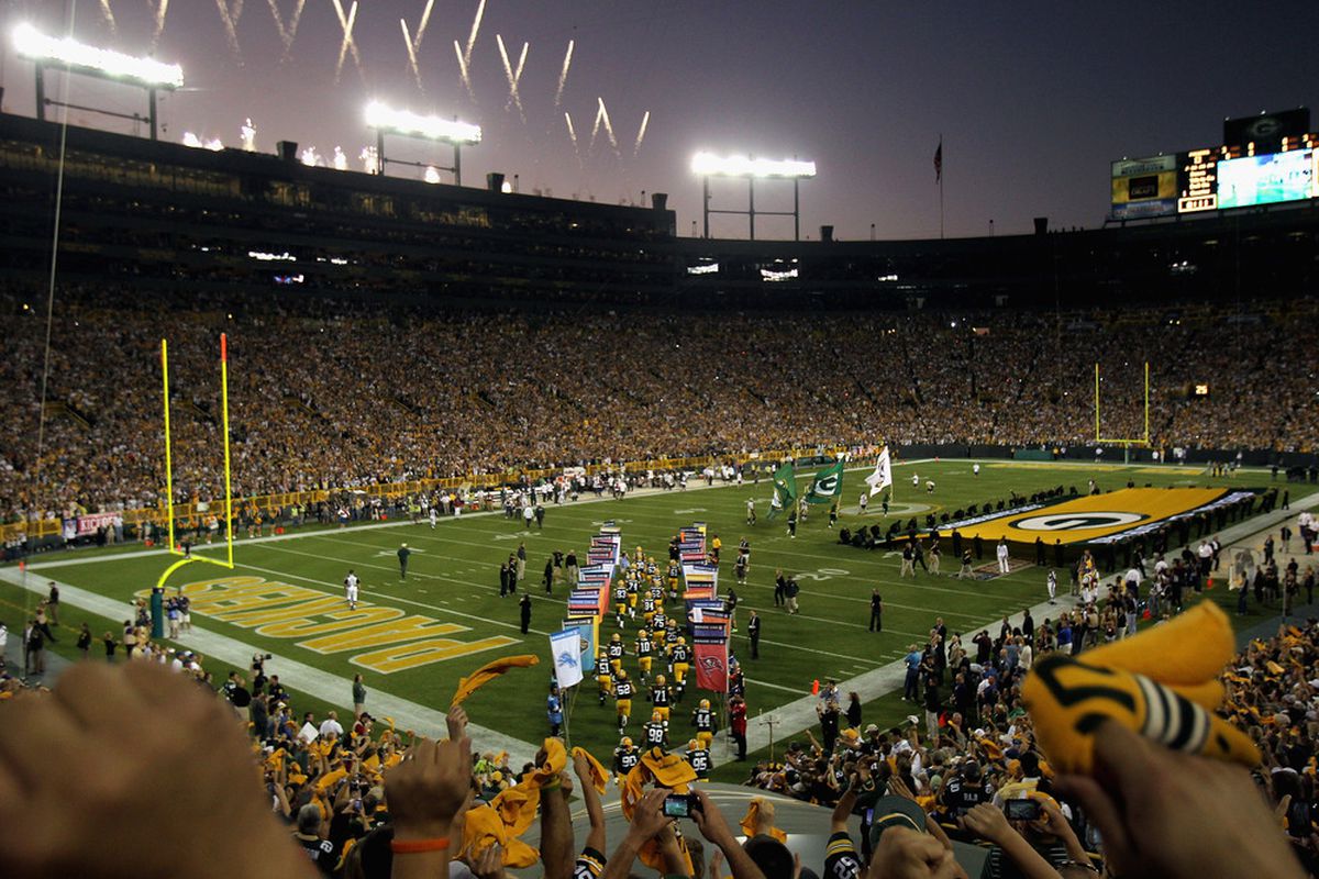 GREEN BAY, WI - SEPTEMBER 08: The Green Bay Packers run onto the field before taking on the New Orleans Saints in the season opening game at Lambeau Field on September 8, 2011 in Green Bay, Wisconsin.  (Photo by Jonathan Daniel/Getty Images)
