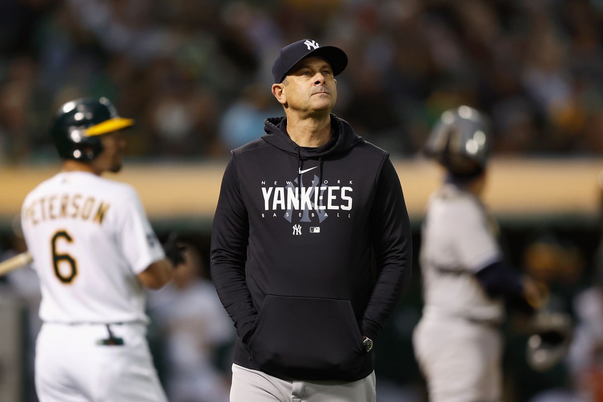 Manager Aaron Boone of the New York Yankees looks on during the game against the Oakland Athletics at RingCentral Coliseum on June 27, 2023 in Oakland, California.