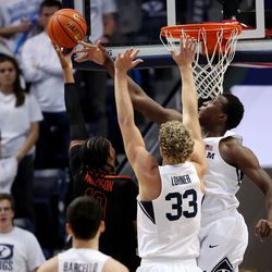 Brigham Young Cougars forward Fousseyni Traore (45) blocks a shot by Pacific Tigers guard Alphonso Anderson (10) as BYU and Pacific play in an NCAA basketball game in Provo at the Marriott Center on Thursday, Jan. 6, 2022. BYU won 73-51.