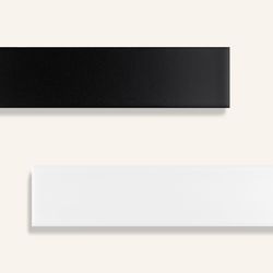 Updated subway tile/ MEROLA TILE: Glazed in glossy black or white, these elongated rectangles, which measure 13/4 by 73/4 inches, work for floors as well as walls. Metro Soho Subway Tile, $11.34 per square foot; homedepot.com 