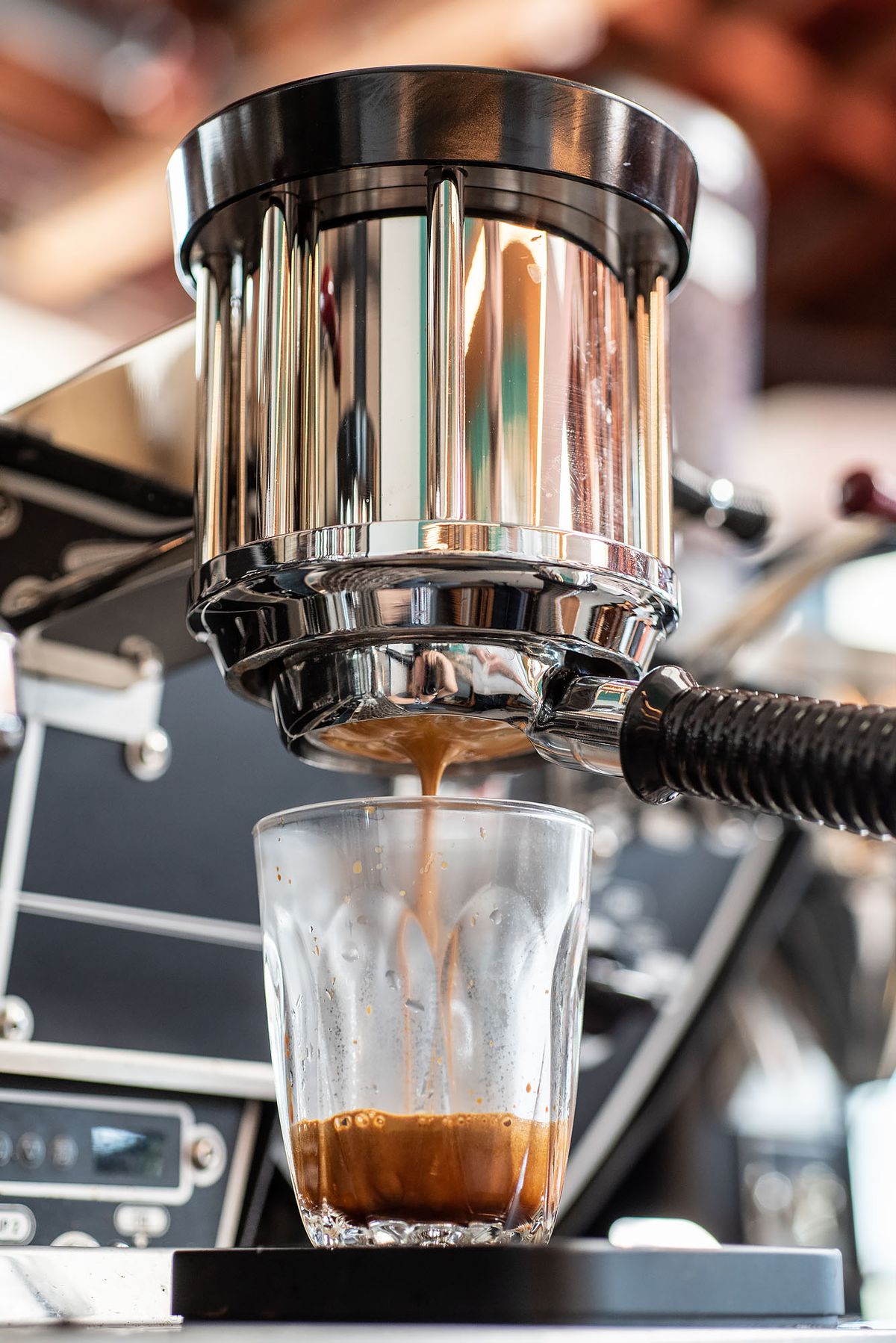 An espresso machine drips down slowly.