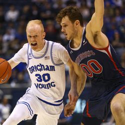 Brigham Young Cougars guard TJ Haws (30) dribbles the ball while guarded by Saint Mary's Gaels guard Tanner Krebs (0) at the Marriott Center in Provo on Thursday, Jan. 24, 2019.