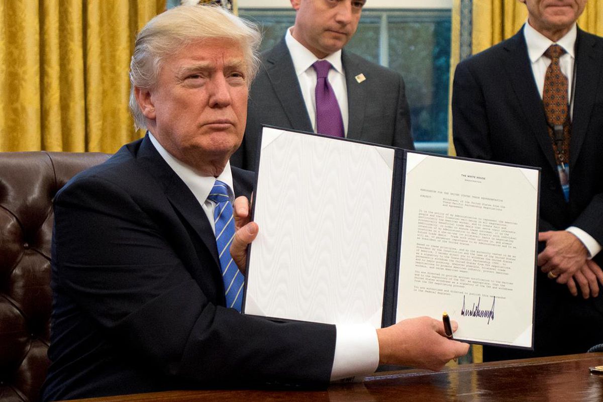 Trump signing an executive order