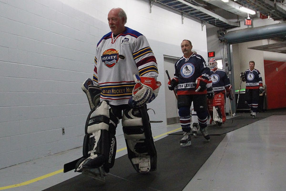 TORONTO ON - NOVEMBER 07: Bill Smith and Bryan Trottier lead players out for the Legends Classic Hockey Game at the Air Canada Centre on November 7 2010 in Toronto Canada.  (Photo by Bruce Bennett/Getty Images)
