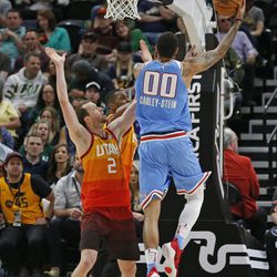 Sacramento Kings center Willie Cauley-Stein (00) goes to the basket as Utah Jazz forward Joe Ingles (2) defends in the first half during an NBA basketball game Saturday, March 17, 2018, in Salt Lake City. (AP Photo/Rick Bowmer)