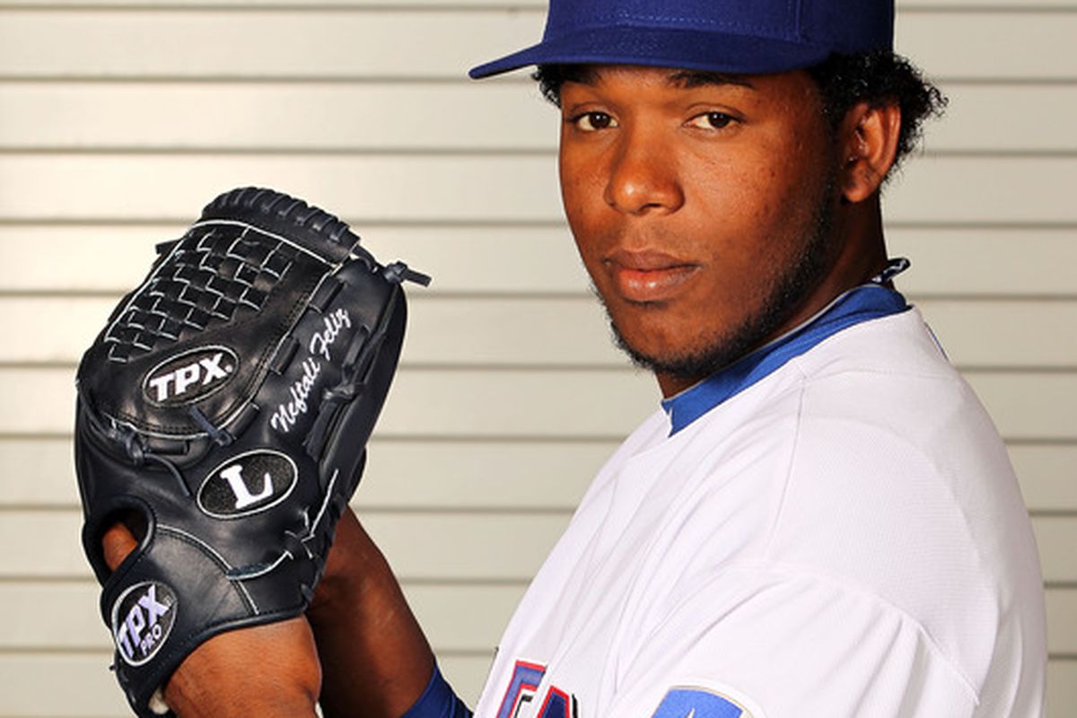 SURPRISE, AZ - FEBRUARY 28:  Neftali Feliz #30 of the Texas Rangers poses during spring training photo day on February 28, 2012 in Surprise, Arizona.  (Photo by Jamie Squire/Getty Images)