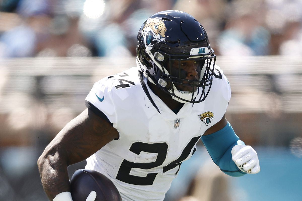 Carlos Hyde #24 of the Jacksonville Jaguars runs with the ball against the Arizona Cardinals at TIAA Bank Field on September 26, 2021 in Jacksonville, Florida.
