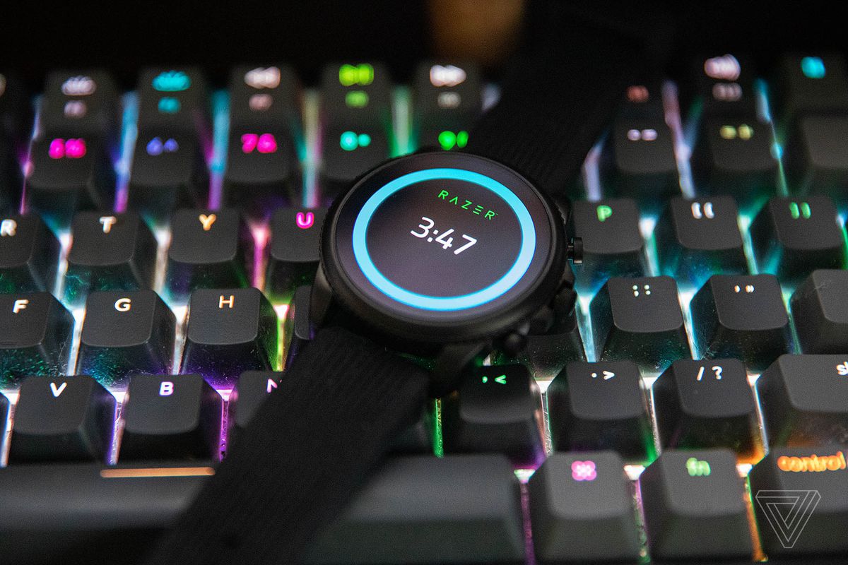 The Razer X Fossil Gen 6 on top of a lit-up mechanical keyboard.