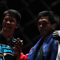 Kevin Belingon poses with his coach, Mark Sangiao after winning at ONE FC 8