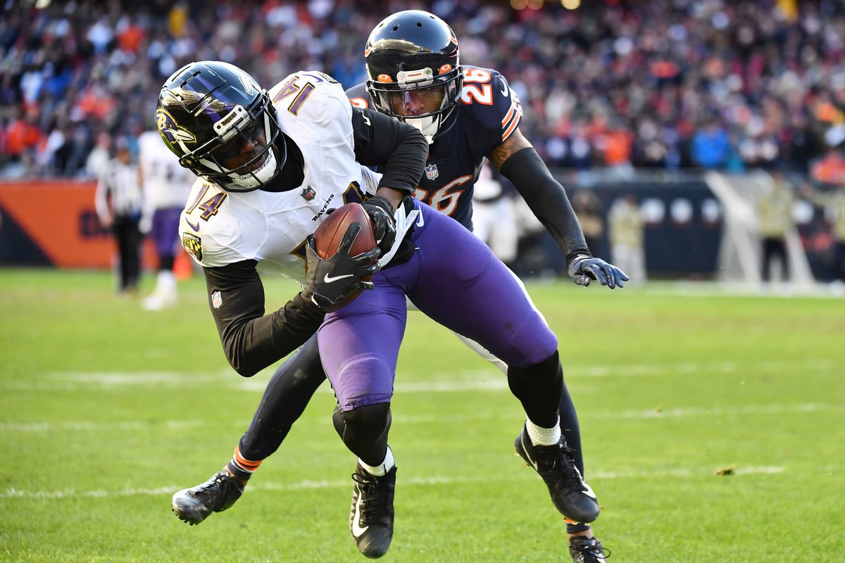 Sammy Watkins #14 of the Baltimore Ravens is tackled by Deon Bush #26 of the Chicago Bears during the fourth quarter at Soldier Field on November 21, 2021 in Chicago, Illinois.