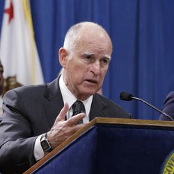 California Gov. Jerry Brown discusses proposed legislation to increase the state's minimum wage to $15 per hour by 2022, during a news conference in Sacramento, Calif. Monday March 28, 2016. If approved by the Legislature,4 California would be the first state to raise the minimum wage to $15. 