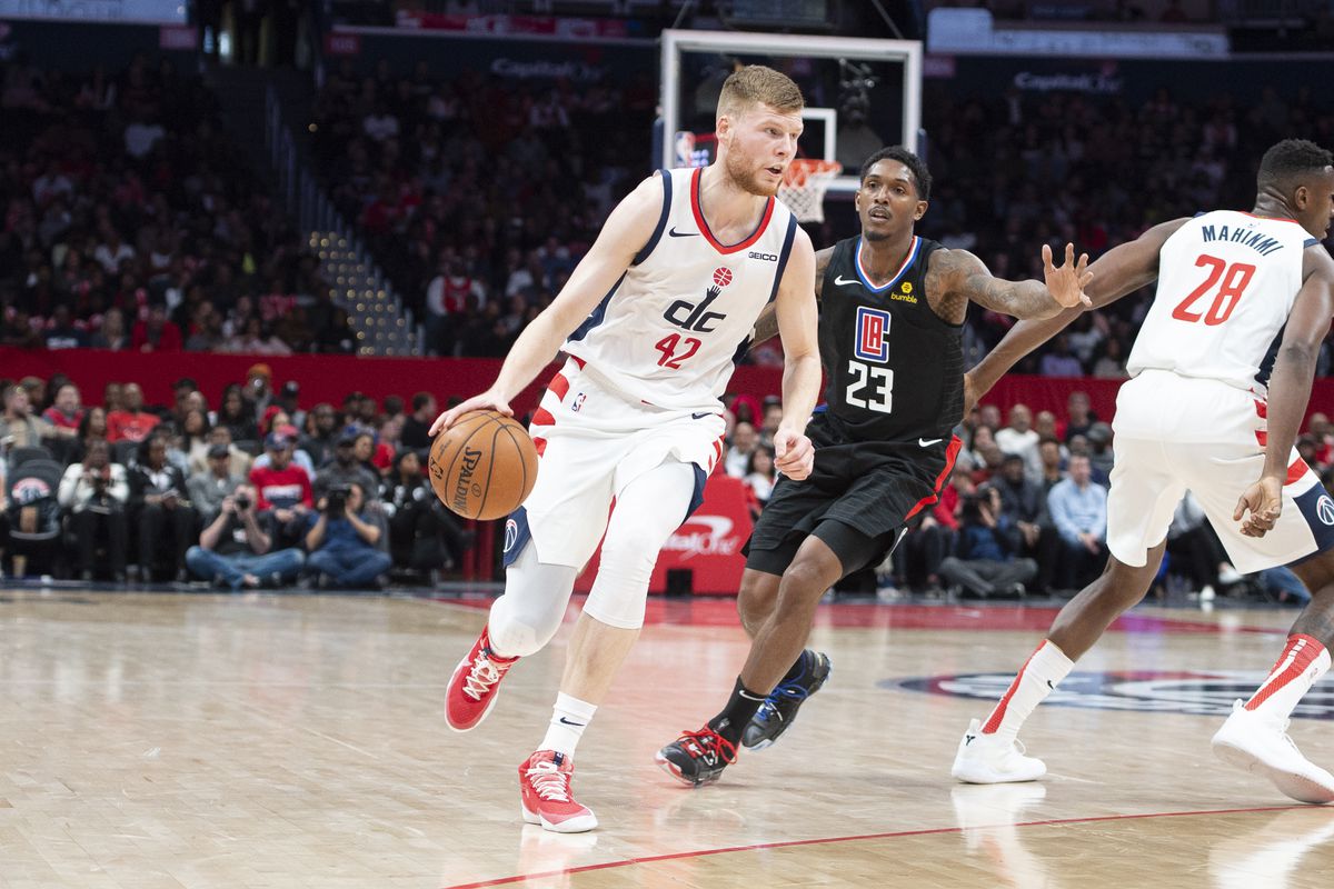 Washington Wizards forward Davis Bertans dribbles as Los Angeles Clippers guard Lou Williams defends dubbing the second half at Capital One Arena.