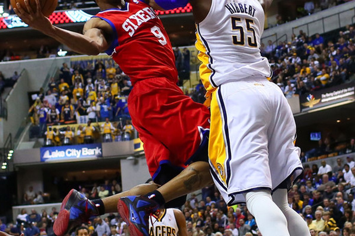 April 21, 2012; Indianapolis, IN, USA; Philadelphia 76ers small forward Andre Iguodala (9) shoots the ball against Indiana Pacers center Roy Hibbert (55) at Bankers Life Fieldhouse. Mandatory credit: Michael Hickey-US PRESSWIRE