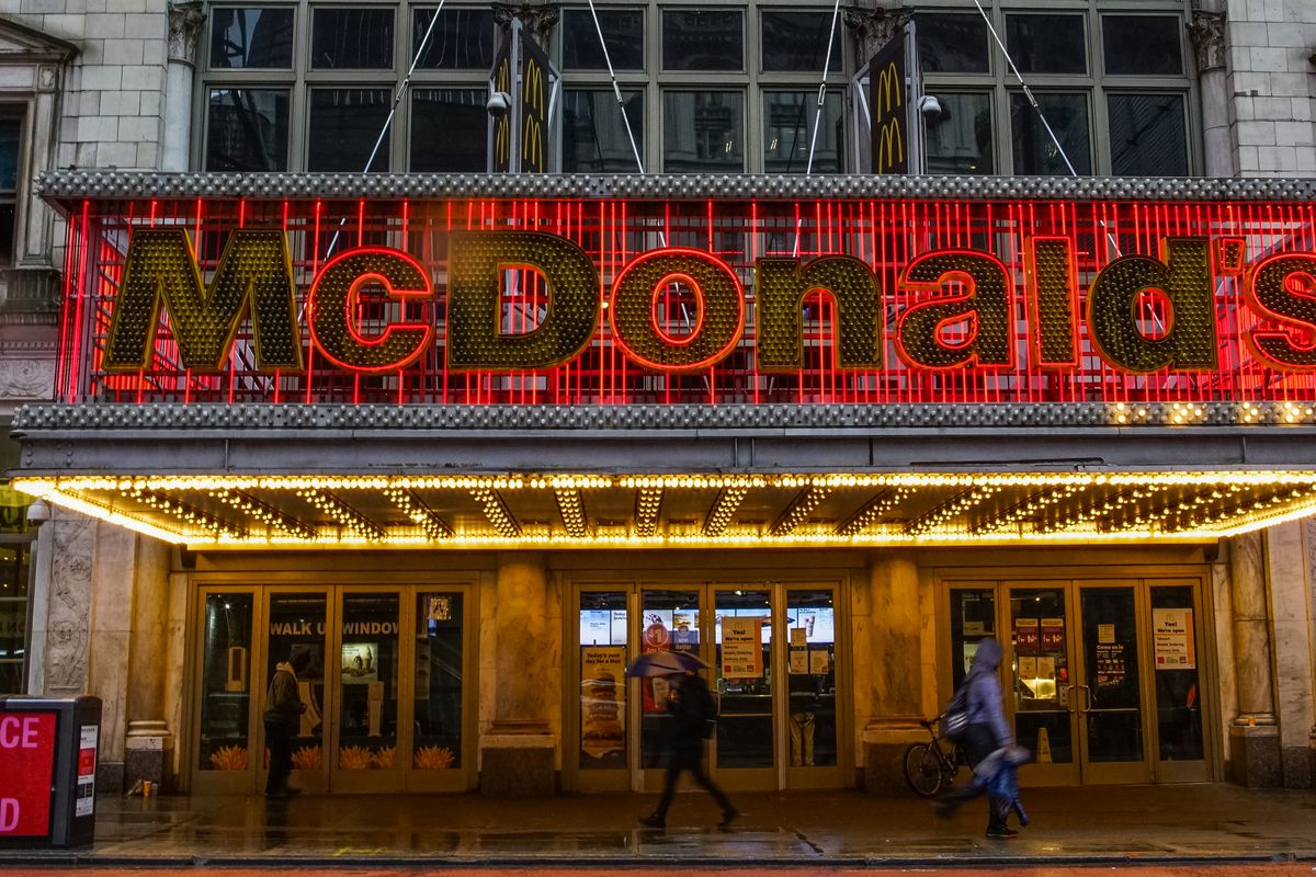 People walk in front of a McDonald’s at Times Square on April 30, 2020 in New York City.