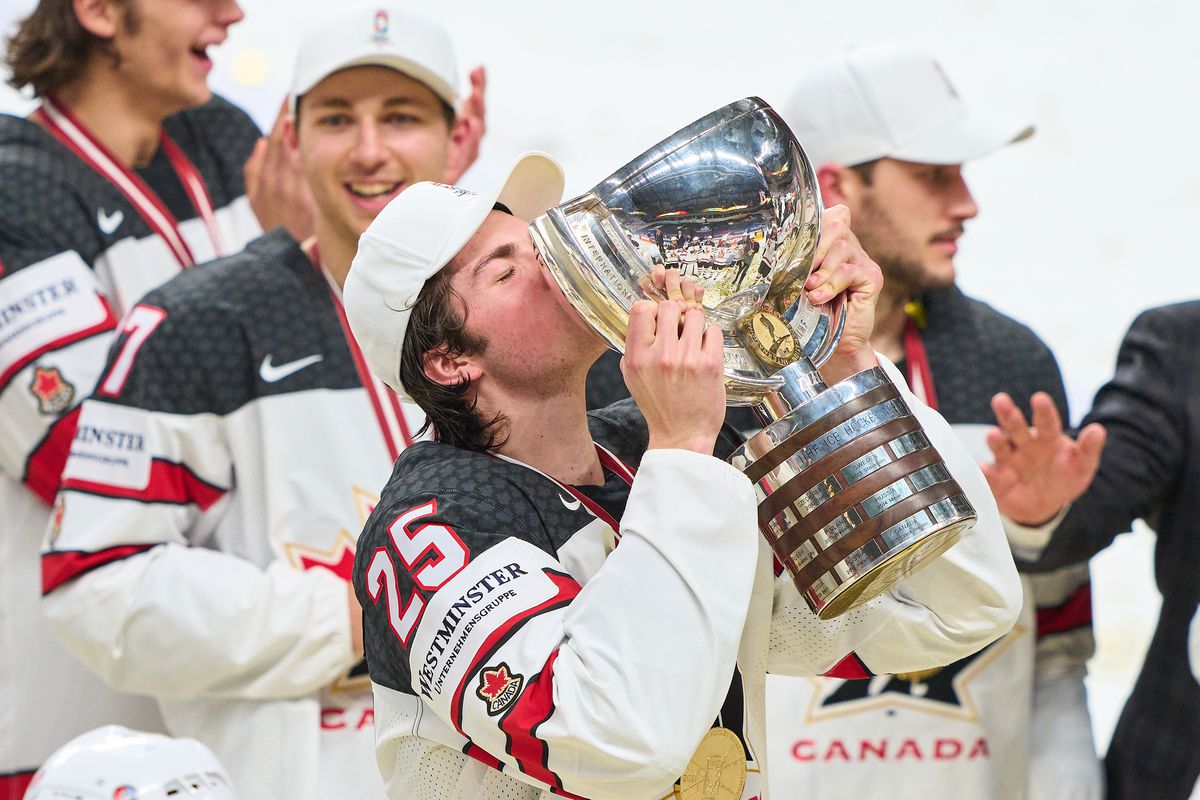 Owen Power #25 of Canada and Team Canada celebrate with trophy after the 2021 IIHF Ice Hockey World Championship Gold Medal Game game between Finalist 1 and Finalist 2 at Arena Riga on June 6, 2021 in Riga, Latvia.