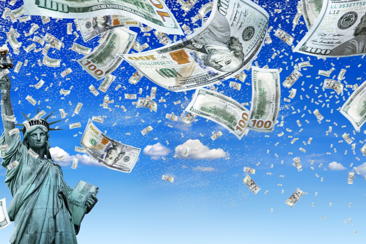 Statue of liberty under a sky of floating 100 dollar bills
