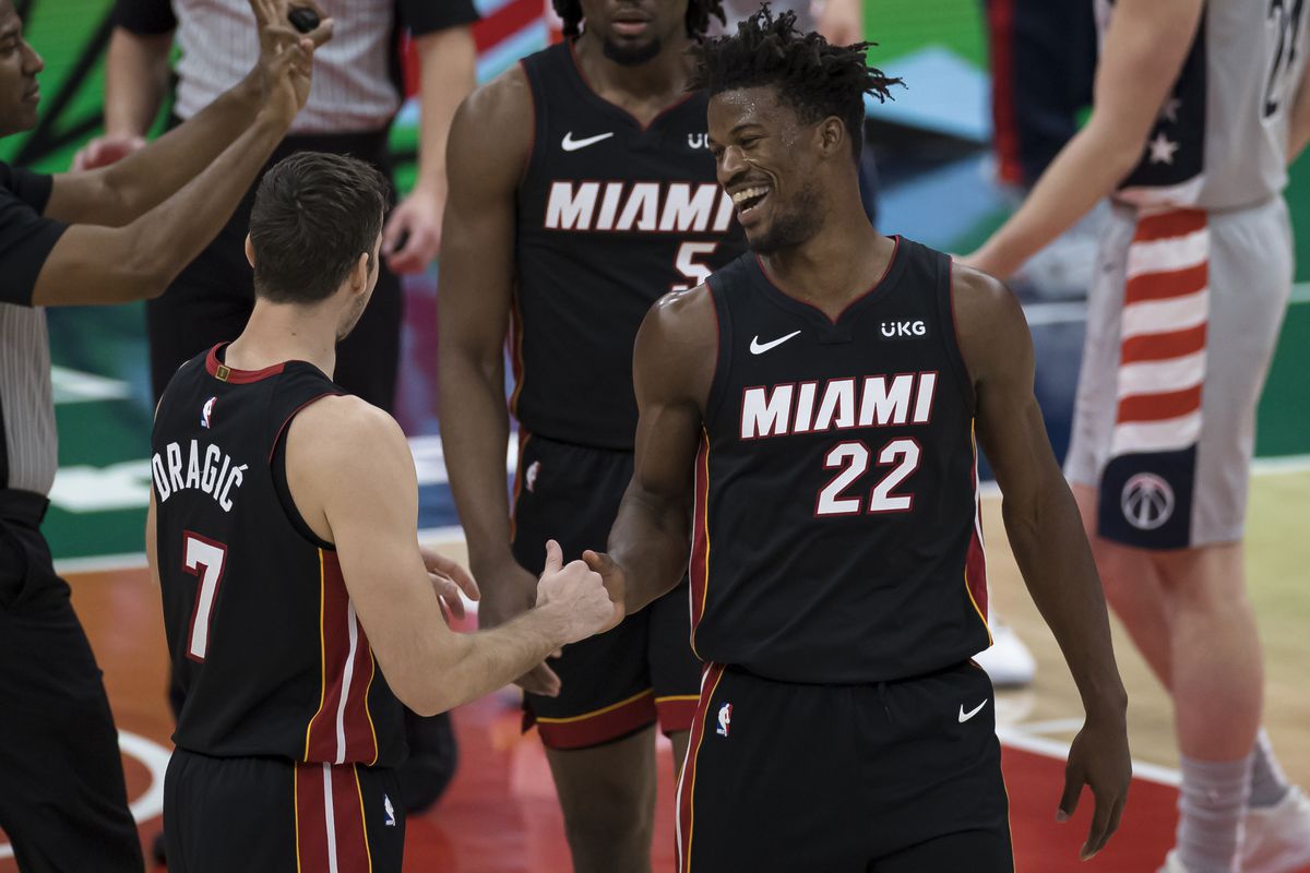 Jimmy Butler of the Miami Heat celebrates with Goran Dragic after a play against the Washington Wizards during the second half at Capital One Arena on January 9, 2021 in Washington, DC.&nbsp;