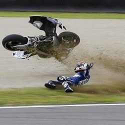 France's Randy De Puniet crashes during a free practice session for Sunday's Italian Moto GP, at the Mugello race circuit, in Scarperia, Italy, Saturday, June 1, 2013.
