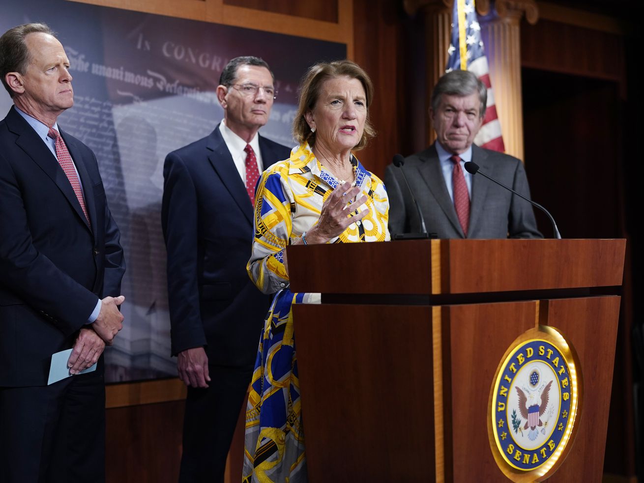 Sen. Shelley Moore Capito speaks at the Capitol in Washington, Thursday, May 27, 2021, as from left, Sen. Pat Toomey, R-Pa., Sen. Barrasso, R-Wy. and Sen. Roy Blunt, R-Mo., look on. Republican senators outlined a $928 billion infrastructure proposal Thursday, a counteroffer to President Joe Biden’s more sweeping plan as the two sides struggle to negotiate a bipartisan compromise and remain far apart on how to pay for the massive spending.