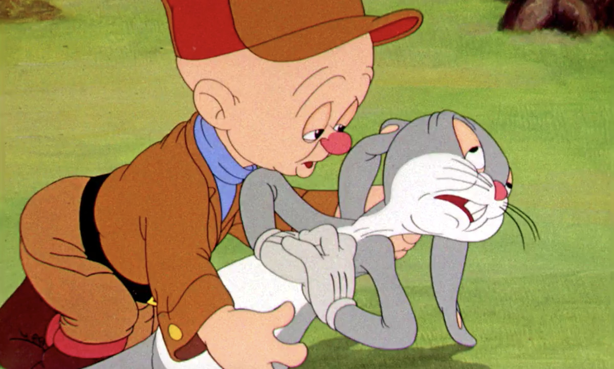 Elmer Fudd sadly holds Bugs, who’s pretending at great length that he’s dying