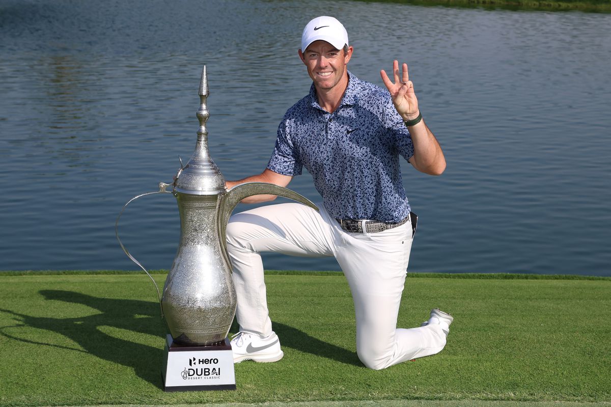 Rory McIlroy of Northern Ireland poses with the trophy on the 18th green following victory in the final round of the Hero Dubai Desert Classic at Emirates Golf Club on January 30, 2023 in Dubai, United Arab Emirates.