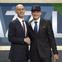 Duke's Grayson Allen, right, poses with NBA Commissioner Adam Silver after he was picked 21st overall by the Utah Jazz during the NBA basketball draft in New York, Thursday, June 21, 2018. (AP Photo/Kevin Hagen)