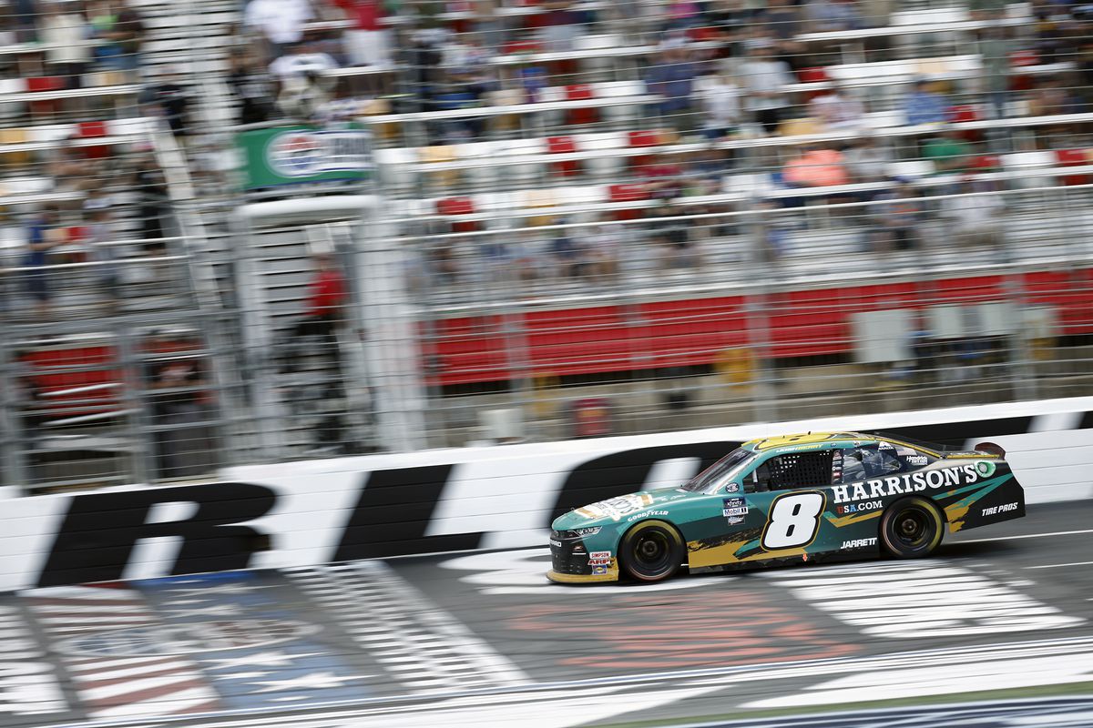 Josh Berry, driver of the #8 Harrison’s USA Chevrolet, crosses the finish line to win the NASCAR Xfinity Series Alsco Uniforms 300 at Charlotte Motor Speedway on May 28, 2022 in Concord, North Carolina.