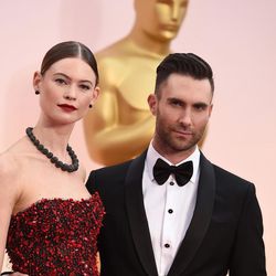 Adam Levine, right, and Behati Prinsloo arrive at the Oscars on Sunday, Feb. 22, 2015, at the Dolby Theatre in Los Angeles. 