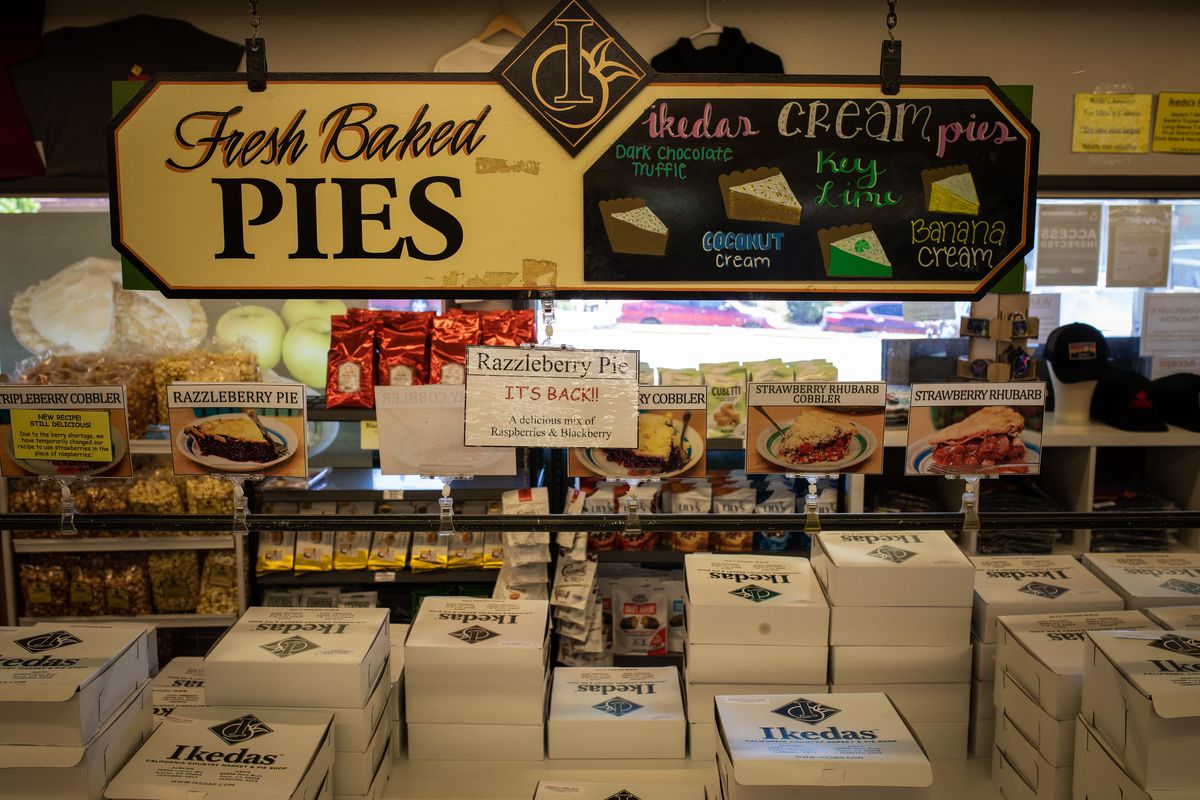 A display of pies in boxes.
