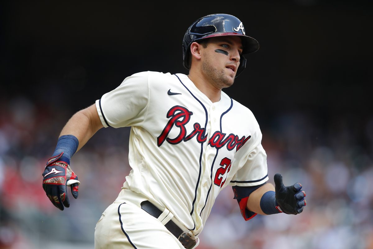 Austin Riley #27 of the Atlanta Braves rounds first as he hits an RBI double in the sixth inning of an MLB game against the Washington Nationals at Truist Park on August 8, 2021 in Atlanta, Georgia.