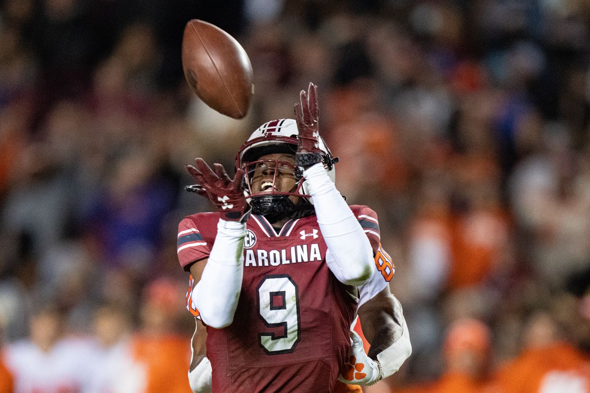 COLUMBIA, SOUTH CAROLINA - NOVEMBER 27: Defensive back Cam Smith #9 of the South Carolina Gamecocks makes an interception against the Clemson Tigers in the first quarter during their game at Williams-Brice Stadium on November 27, 2021 in Columbia, South Carolina.
