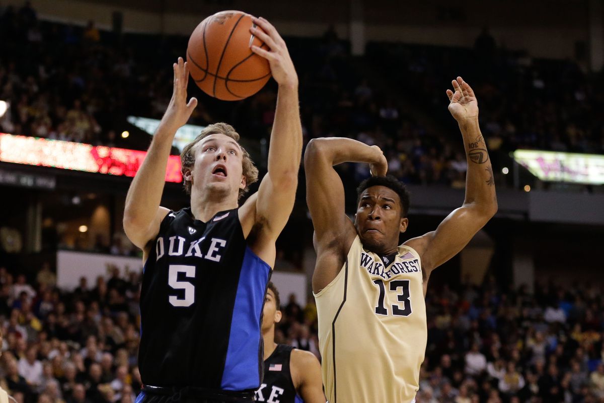 Jan 6, 2016; Winston-Salem, NC, USA; Duke Blue Devils guard Luke Kennard (5) shoots the ball while Wake Forest Demon Deacons guard Bryant Crawford (13) during the second half at Lawrence Joel Veterans Memorial Coliseum. Duke defeated Wake Forest 91-7