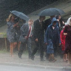 Audience members brave the rain as they make their way to the arena to listen to President Russell M. Nelson and others speak at the Amway Center in Orlando, Florida, on Sunday, June 9, 2019.