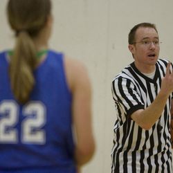 Referee camp participant Rich Green of Draper officiates a basketball game at the University of Utah in 2009. The game was part of a training camp for those who officiate church basketball games. The event was sponsored by the Salt Lake Area Sports Committee for the LDS Church.